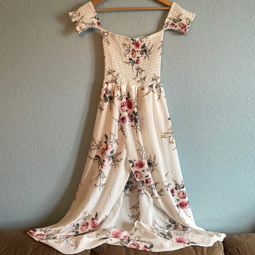 Romantic white floral dress with almost detached off shoulder sleeve.Wrap/highlo